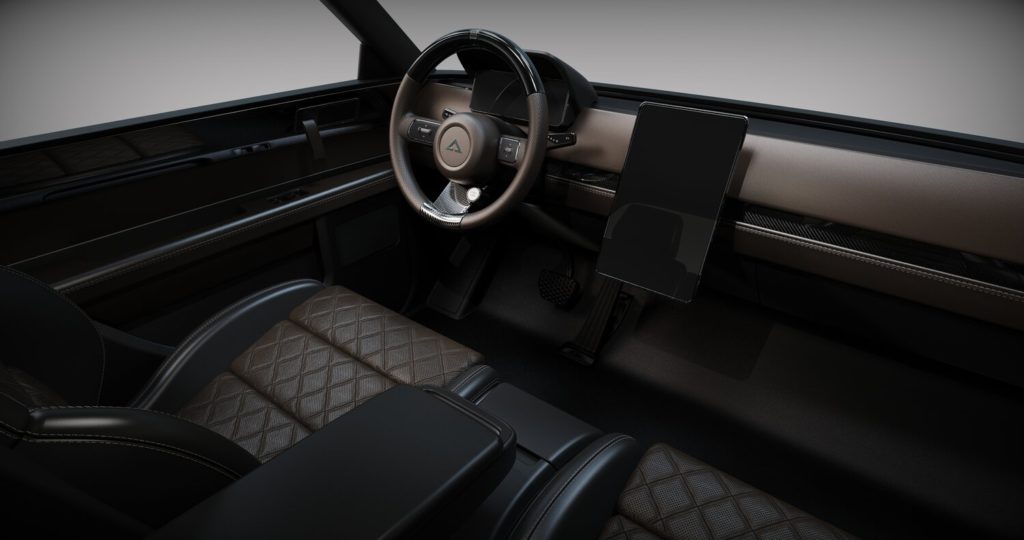תא הנוסעים וסביבת הנהג של הוולף החשמלי של אלפא מוטור, בצבע שחור עם מסך במרכז הרכב